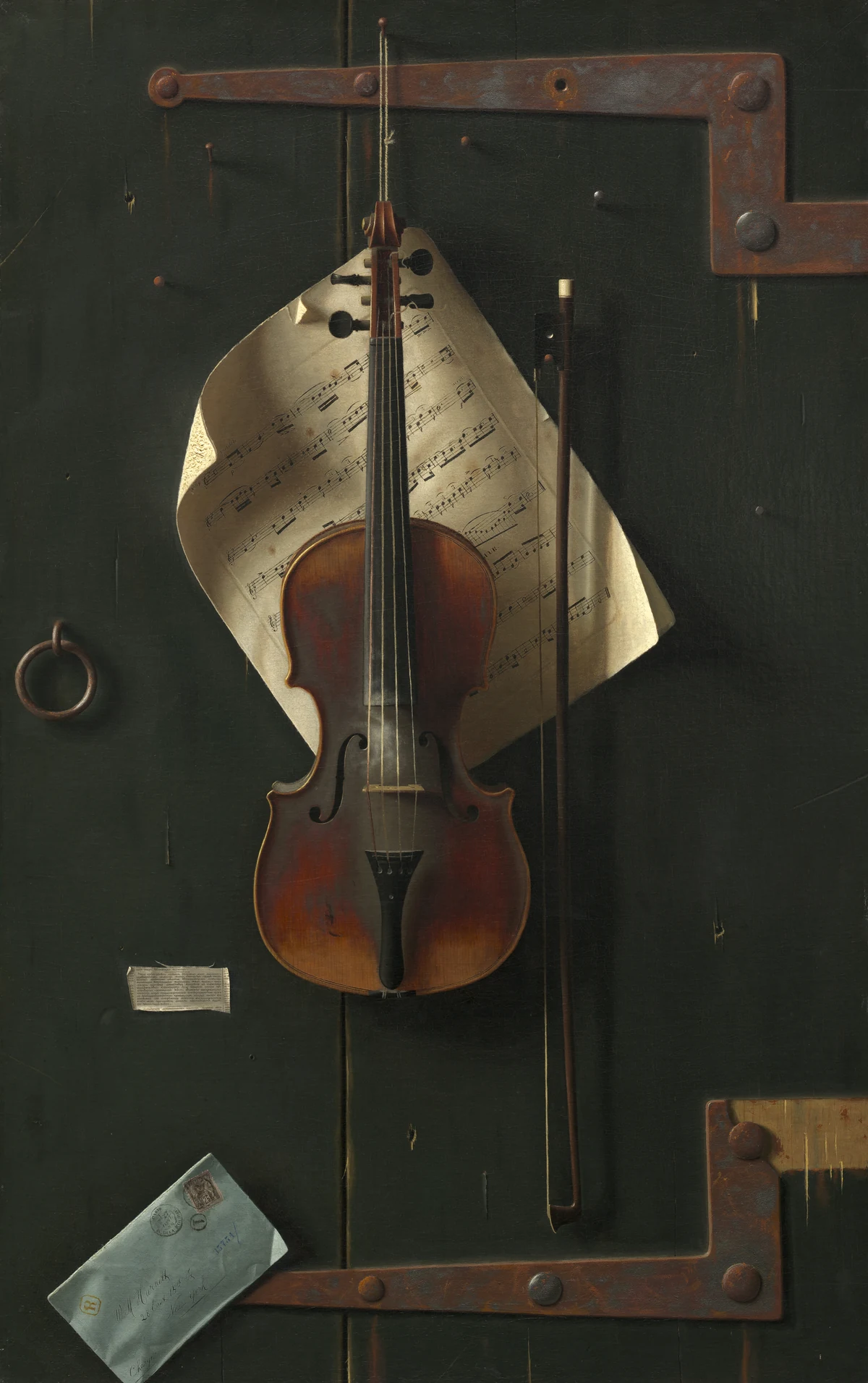 A violin, a bow, sheet music and papers appear to hang from a dark green wooden door.